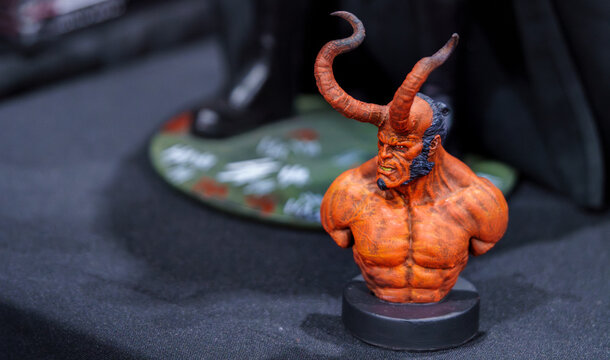 9th Comic Con Convention In GUAYAQUIL, ECUADOR - AUG 04, 2024 - Detailed Hellboy figurine with iconic red skin, horns, and muscular design, captured on a black background.