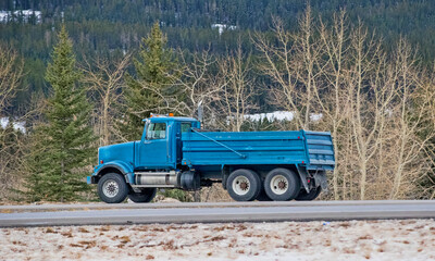 Heavy Cargo on the Road. A truck hauling freight along a highway. Taken in Alberta, Canada