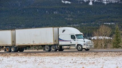 Heavy Cargo on the Road. A truck hauling freight along a highway. Taken in Alberta, Canada