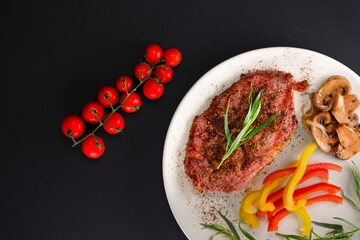 steak with vegetables and spices