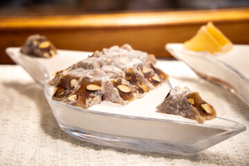 Turkish delight with hazelnuts and pistachios. Colorful Turkish delight full of vibrant flavors and...