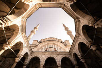 Wide-angle view of the Nuruosmaniye Mosque minarets and courtyard. A stunning example of Ottoman...