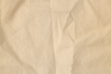 Grunge beige, brown, craft dirty canvas denim fabric stain grain texture background.