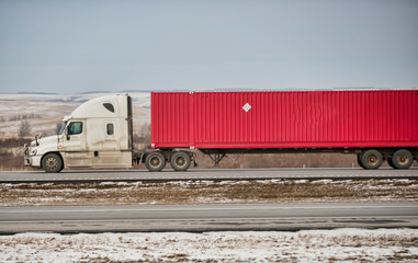 Heavy Cargo on the Road. A truck hauling freight along a highway. Taken in Alberta, Canada