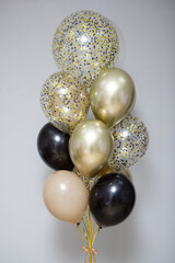 stylish bouquet of balloons for a man with confetti for his birthday