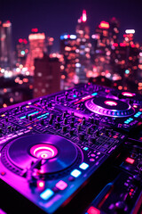 DJ turntables in front of a skyline