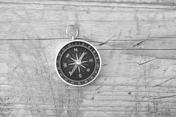 Classic navigation compass on natural background