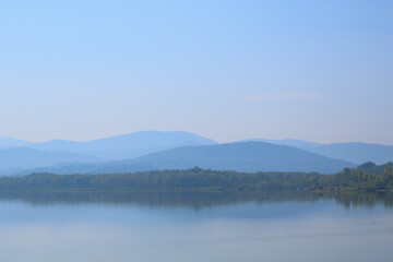 Breathtaking view of majestic mountains under a beautiful sky, where dramatic peaks meet the vibrant hues of the horizon