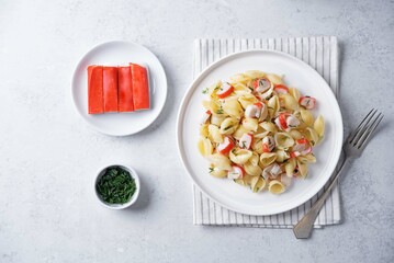 Imitation crab sticks pasta in a plate © nata_vkusidey