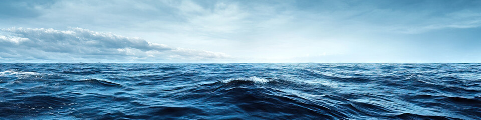 Fototapeta premium The vast expanse of the ocean stretches out before you, with nothing but the sky above and the gentle rocking of the waves below.