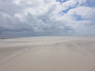 sand dunes and clouds