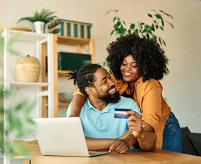 couple credit woman laptop shopping card online technology internet payment computer young man love together order happy