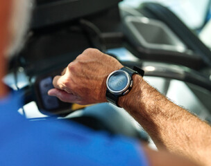 gym sport fitness exercising training mature man running watch smart time smartwatch wristwatch device app checking pulse monitor performance cardio treadmill