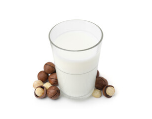 Glass of macadamia milk and nuts isolated on white