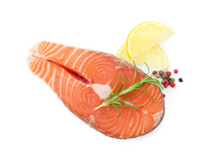 Steak of fresh raw salmon and spices isolated on white, top view