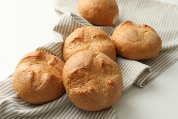 Homemade tasty buns on light table, closeup