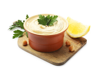 Delicious hummus with chickpeas, parsley and lemon isolated on white