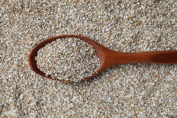 Spoon with fresh rye bran, top view