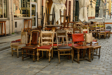 many rare wooden chairs on the street