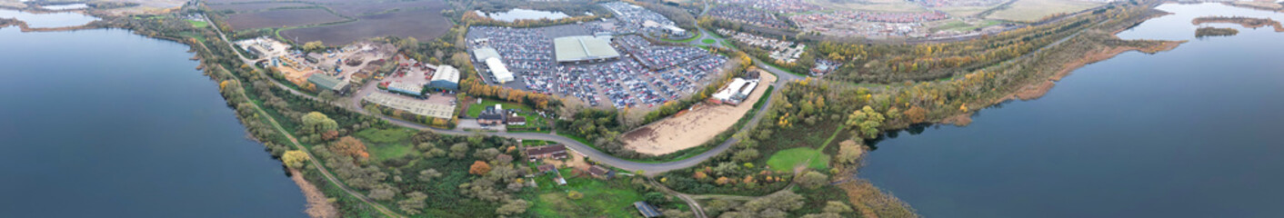 Aerial Panoramic View of Car Auctions Massive Car Parking Lot at Kempston Village of Bedford England United Kingdom. High Angle Footage Captured During Cloudy Evening on November 18th, 2024