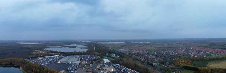 Aerial Panoramic View of Car Auctions Massive Car Parking Lot at Kempston Village of Bedford England United Kingdom. High Angle Footage Captured During Cloudy Evening on November 18th, 2024
