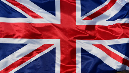 Close-up of the national flag of Great Britain, fluttering in the wind with folds, wave pattern