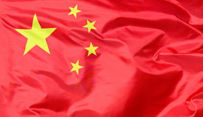 Close-up of the national flag of China, fluttering in the wind with folds, wave pattern