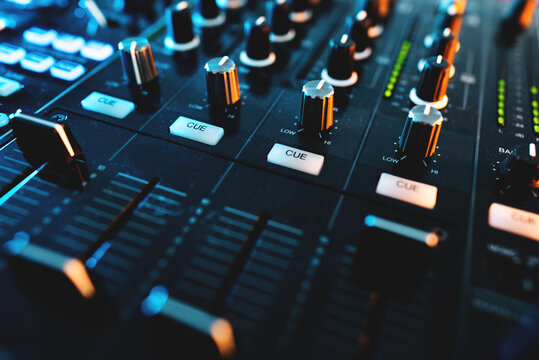 closeup of professional digital pioneer dj decks and audio mixer equipment ready for party in nightclub