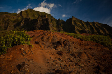 Rocky dirt patch on Hawaiian hill top with distant mountains
