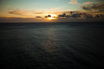 Majestic high shot over ocean and rising sun ahead