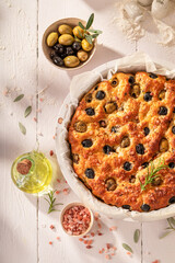 Homemade focaccia made of olives and sea salt.