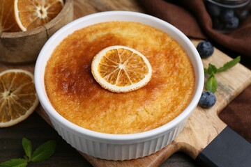 Tasty semolina cake served on wooden table, closeup