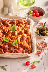 Tasty focaccia with cherry tomatoes and olives.