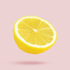 Sliced fresh juicy lemon in air on light pink background. Citrus fruit