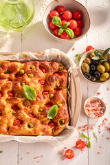 Traditional focaccia with cherry tomatoes and olives.