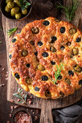Hot focaccia with different types of olives.