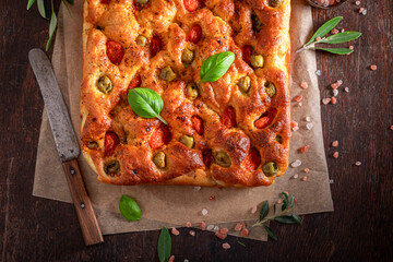Traditional focaccia with olive oil and cherry tomatoes.