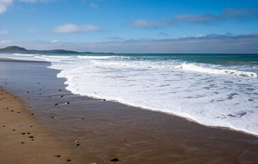 Peaceful sandy beach and calm ocean New Zealand beautiful nature