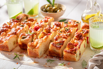 Hot and delicious focaccia freshly baked and served with lemonade.