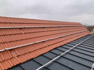 Residential Roof Equipped with Aluminum Mounting Structures Undergoing Preparation for Solar Panel Installation