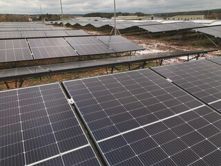 Industrial Roof Covered with Numerous Solar Panels Installed on Metal Frames