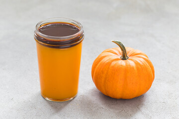 Vegan drink. Pumpkin smoothie with black coffee in a glass. Close up