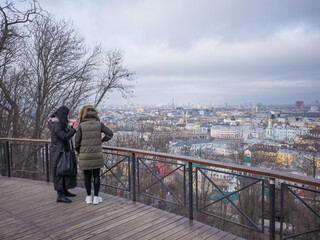 ukrainians seeing the winter cityscape of podil from the hill in capital kyiv