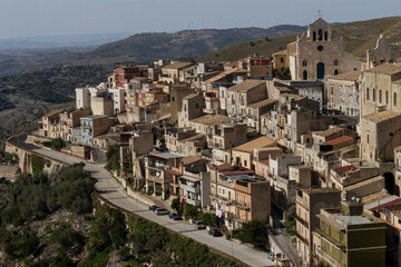 Fototapeta premium Beautiful panorama of the old Sicilian town, bird's eye view of Monterosso, travel around Italy, old architecture on the hill, typical Sicilian buildings, no people, Sicily.