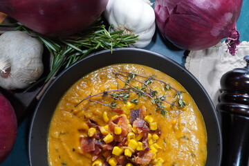  Making Butternut Bisque soup for a cozy Autumn meal. Preparing a soup for dinner from fresh vegetables from the garden.