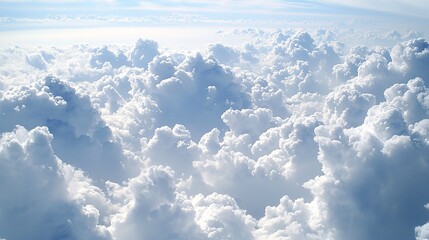 Fototapeta premium Aerial View of Fluffy Cumulus Clouds Blue Sky Bright Sunlight Heavenly Cloudscape