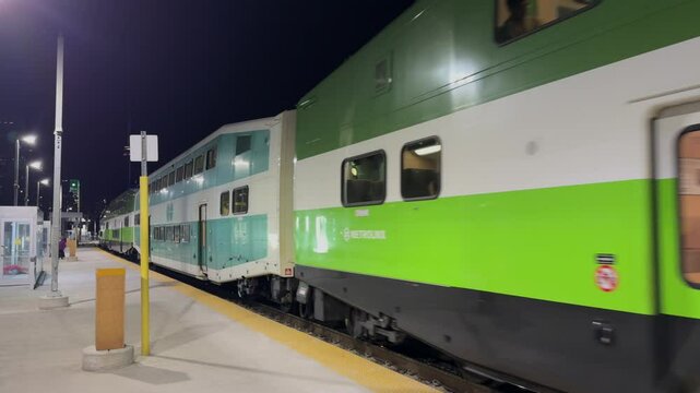 Night train on the platform in Toronto, the train is leaving.