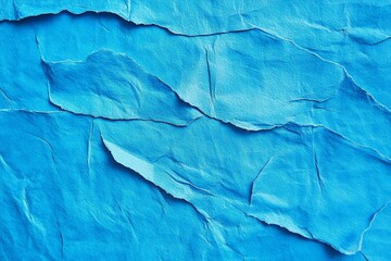 Fototapeta premium Blue Textured Paper Close-Up Vibrant Creases and Folds for Abstract Design