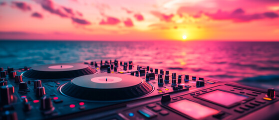 Dj turntable at the beach with sunset in the background