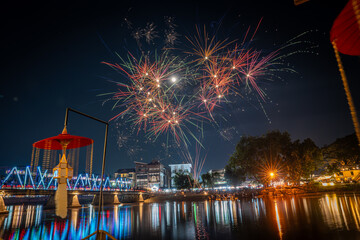  fireworks show at iron bridge across ping river where decorate with a lot of colorful light...